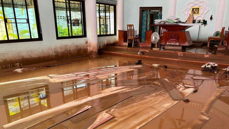 Church volunteers race to clear mud in wake of northern Thailand